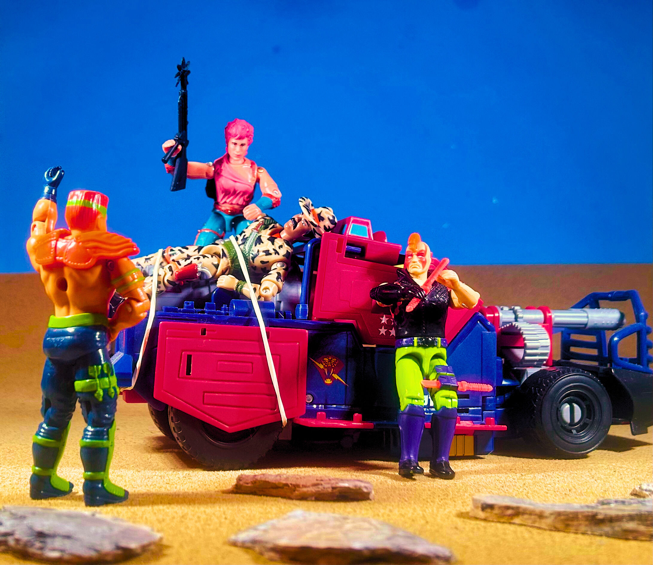 1993 GI Joe Zartan (Ninja Force), leaning against the Thunder Machine while Zarana and Road Pig torment a captured cowboy. Desert scene.